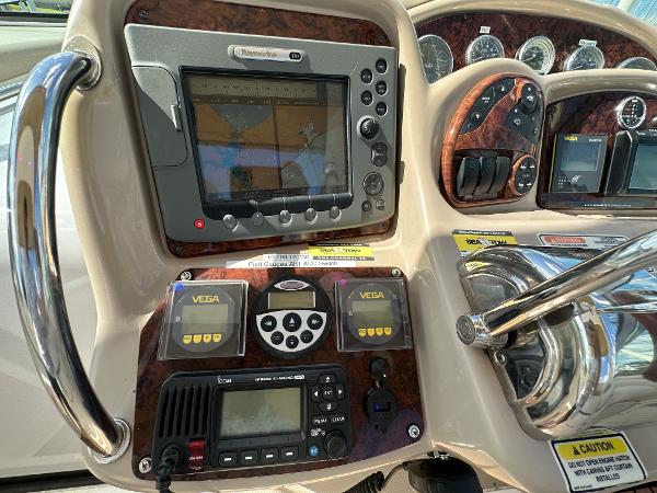 Slide: The Image of Control panel of a 2004 Sea Ray 320 Sundancer boat with navigation equipment. - 23