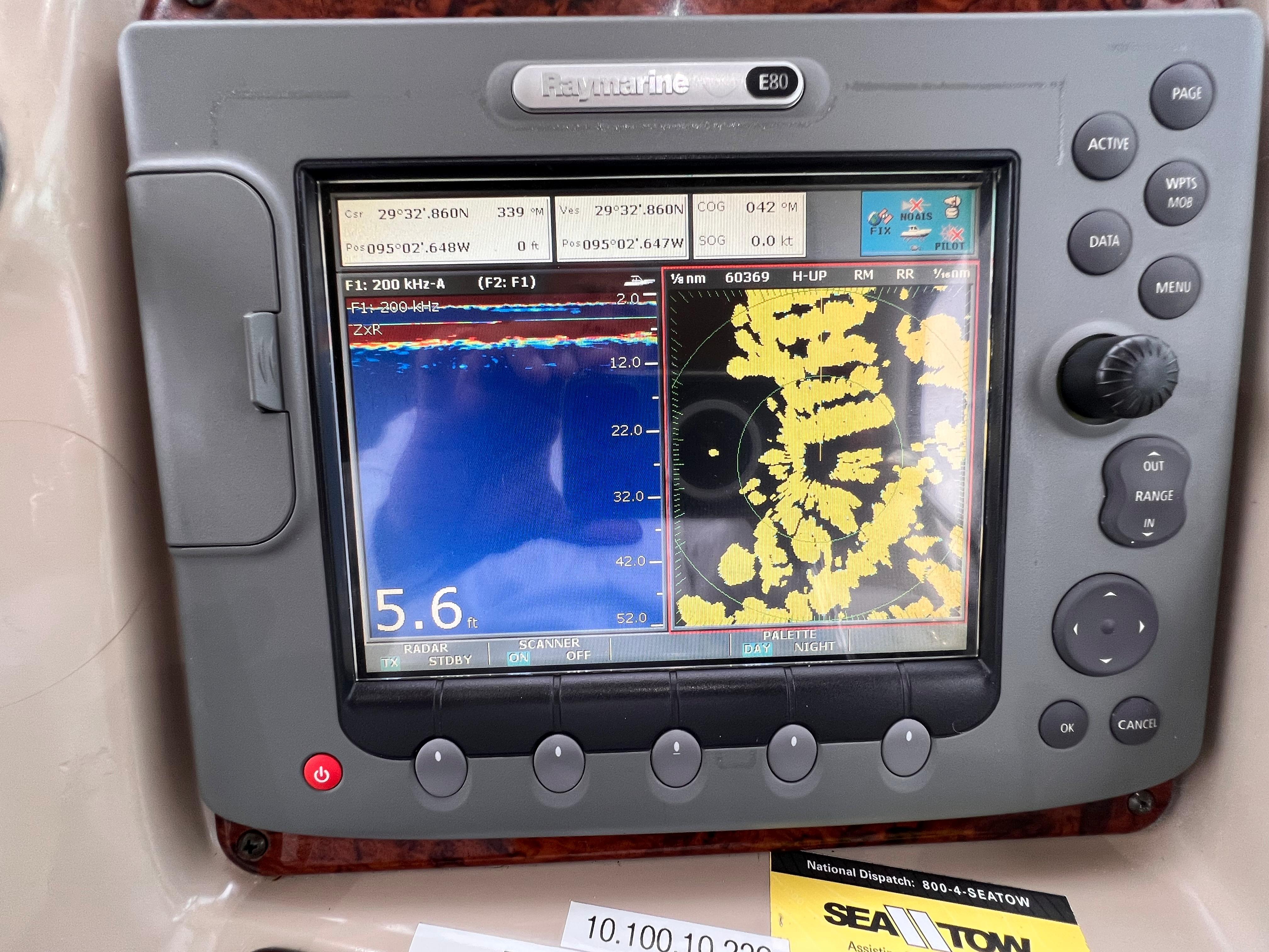 Slide: The Image of Raymarine E80 display on a 2004 Sea Ray 320 Sundancer showing navigation and sonar data. - 25
