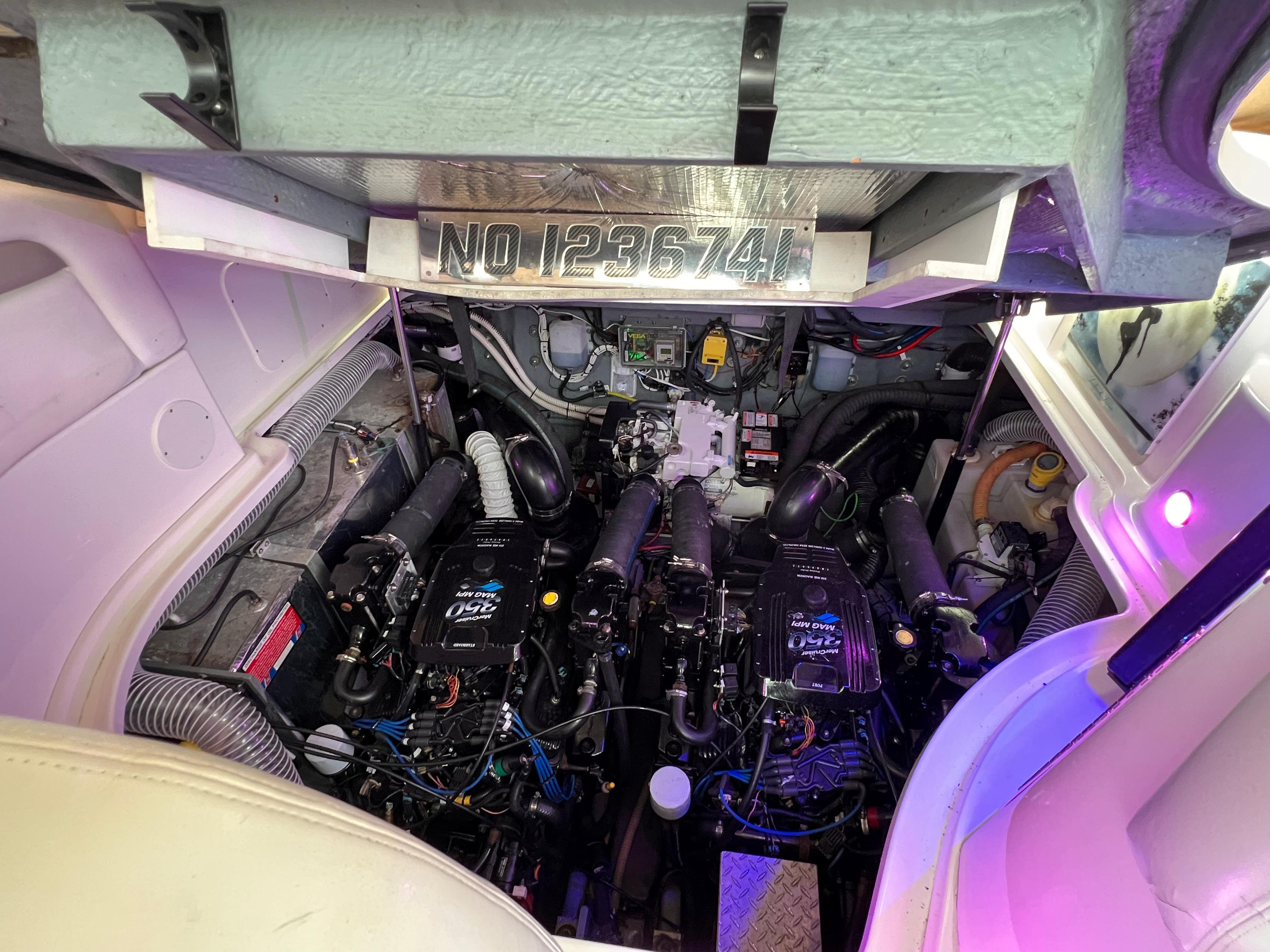 Slide: The Image of Engine compartment of a 2004 Sea Ray 320 Sundancer boat. - 28