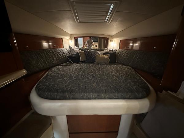 Slide: The Image of Interior cabin of 2004 Sea Ray 320 Sundancer with bed and cushions. - 36