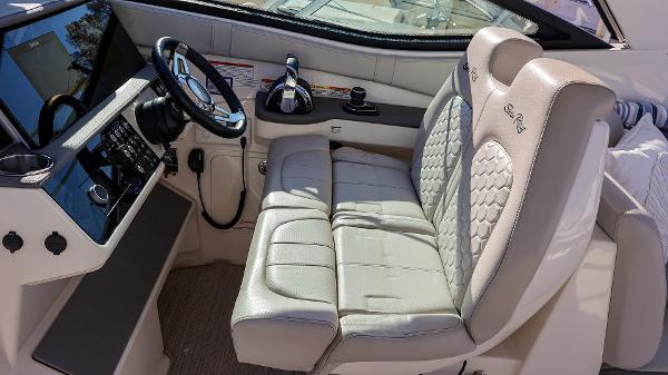 Slide: The Image of Interior of 2021 Sea Ray 320 Sundancer boat with modern helm and seating. - 13