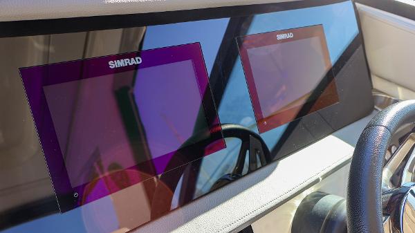 Slide: The Image of Simrad navigation screens on 2021 Sea Ray 320 Sundancer boat dashboard. - 16