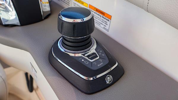 Slide: The Image of Joystick control on 2021 Sea Ray 320 Sundancer boat dashboard. - 17