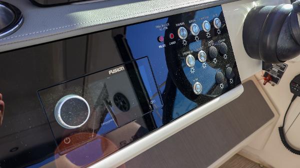 Slide: The Image of Control panel of 2021 Sea Ray 320 Sundancer boat with Fusion audio system. - 19
