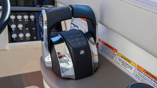 Slide: The Image of Throttle controls on 2021 Sea Ray 320 Sundancer boat dashboard. - 21