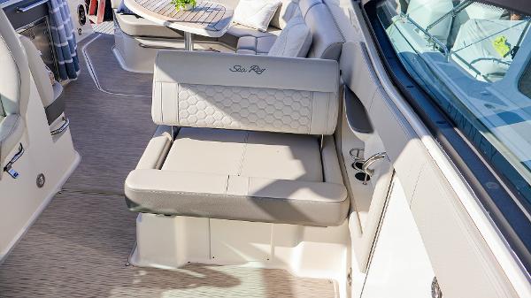 Slide: The Image of Luxurious interior of 2021 Sea Ray 320 Sundancer boat with plush seating. - 23