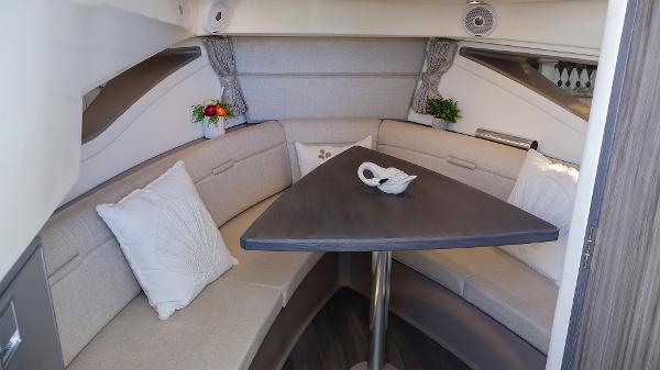 Slide: The Image of Luxurious interior of 2021 Sea Ray 320 Sundancer with elegant seating and decor. - 35