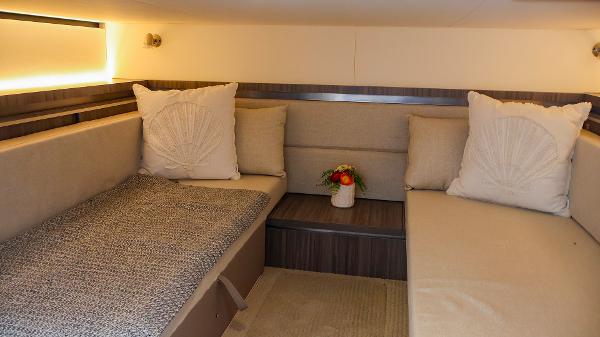 Slide: The Image of Luxurious interior of 2021 Sea Ray 320 Sundancer with cozy seating and elegant decor. - 36