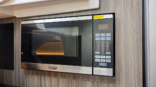 Slide: The Image of Built-in microwave in 2021 Sea Ray 320 Sundancer yacht kitchen. - 40