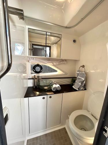 Slide: The Image of Modern bathroom in 2021 Sea Ray 320 Sundancer yacht with sleek fixtures. - 43