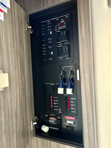 Slide: The Image of Electrical control panel on a 2021 Sea Ray 320 Sundancer boat. - 45