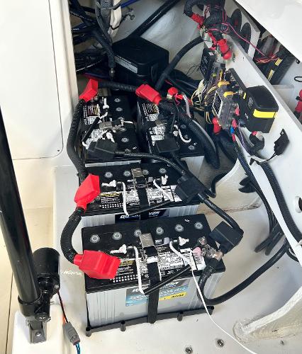 Slide: The Image of Battery compartment of a 2021 Sea Ray 320 Sundancer boat. - 48