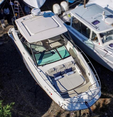 Slide: The Image of 2021 Sea Ray 320 Sundancer luxury motorboat docked aerial view. - 6