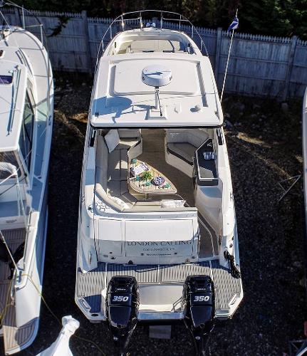 Slide: The Image of 2021 Sea Ray 320 Sundancer boat with twin 350 engines, docked and viewed from above. - 7
