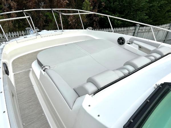 Slide: The Image of 2021 Sea Ray 320 Sundancer boat with spacious sun deck and comfortable seating. - 9