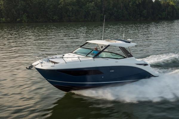 Slide: The Image of 2023 Sea Ray Sundancer 320 cruising on a lake. - 1