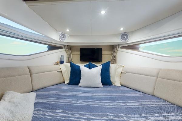 Slide: The Image of Luxurious cabin interior of 2023 Sea Ray Sundancer 320 with cozy bedding and modern amenities. - 10
