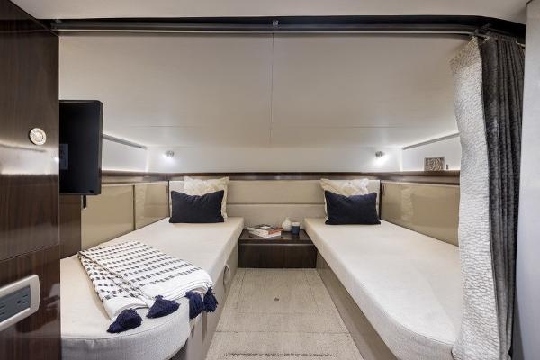 Slide: The Image of Interior cabin of 2023 Sea Ray Sundancer 320 with twin beds and modern decor. - 12