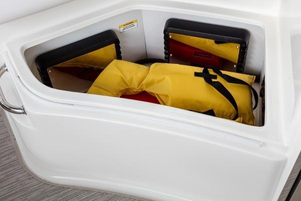Slide: The Image of Storage compartment on a 2023 Sea Ray Sundancer 320 boat with life jackets. - 23