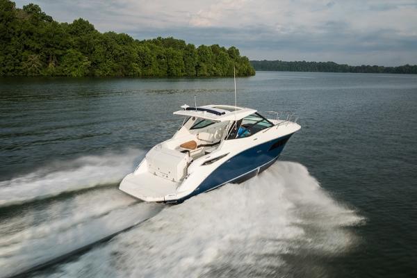 Slide: The Image of 2023 Sea Ray Sundancer 320 cruising on a lake. - 3