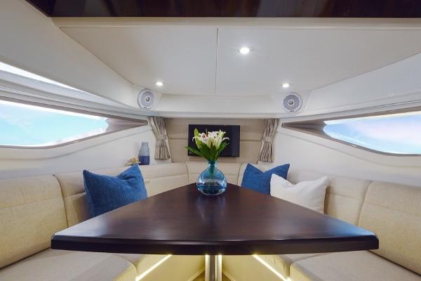Slide: The Image of Interior of 2023 Sea Ray Sundancer 320 with elegant seating and table. - 9