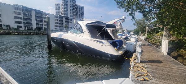 Slide: The Image of 2008 Sea Ray 350 Sundancer docked at marina with waterfront buildings. - 1