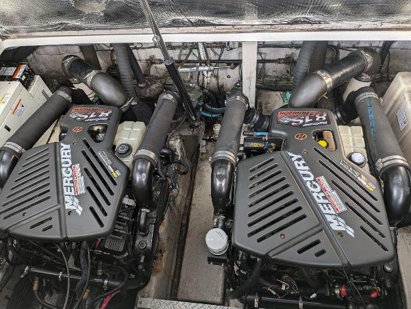 Slide: The Image of Twin Mercury engines in a 2004 Sea Ray 360 Sundancer boat engine compartment. - 18