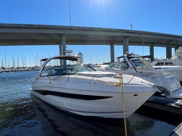 Slide: The Image of 2015 Sea Ray 370 Venture docked under a bridge on a sunny day. - 1
