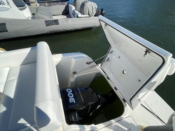 Slide: The Image of 2015 Sea Ray 370 Venture boat with open engine compartment at the dock. - 10