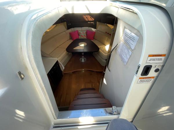 Slide: The Image of Interior of 2015 Sea Ray 370 Venture with cozy seating and wooden flooring. - 26