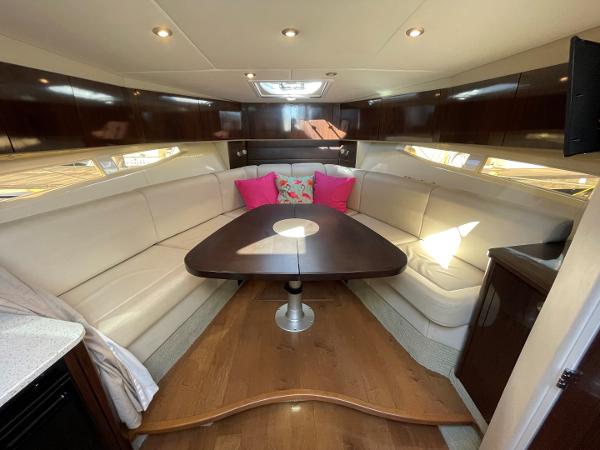 Slide: The Image of Luxurious interior of 2015 Sea Ray 370 Venture with plush seating and wooden table. - 27
