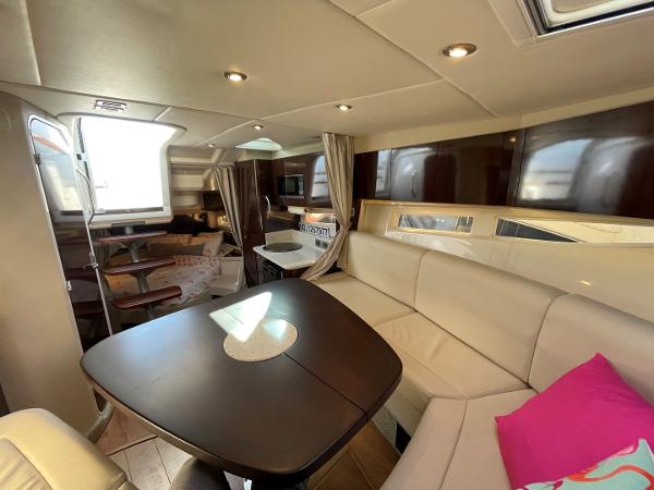 Slide: The Image of Luxurious interior of 2015 Sea Ray 370 Venture yacht with modern seating and dining area. - 28