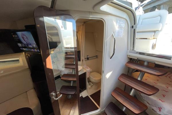 Slide: The Image of Interior of 2015 Sea Ray 370 Venture yacht with bathroom and wooden stairs. - 36