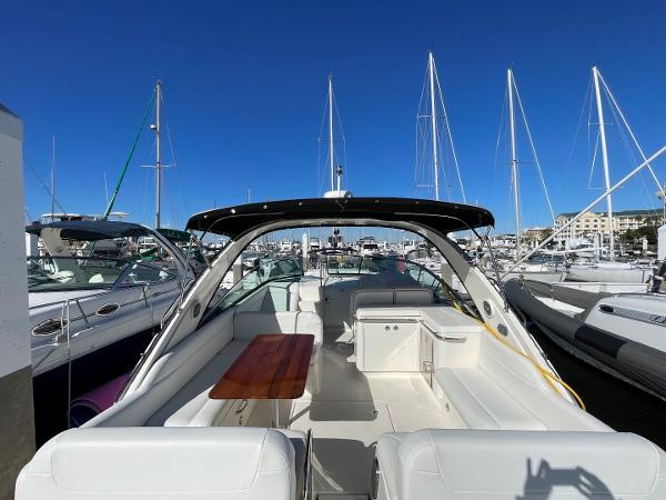 Slide: The Image of 2015 Sea Ray 370 Venture yacht docked at marina with clear blue sky. - 4
