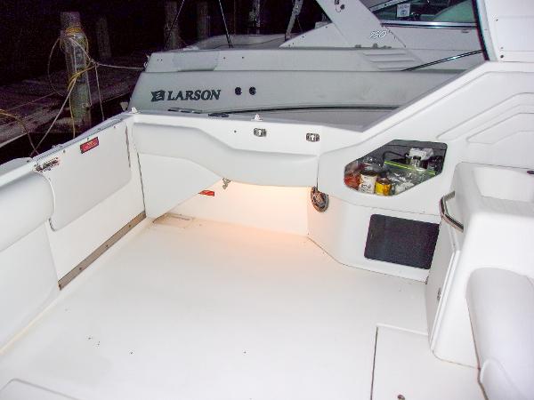 Slide: The Image of 1992 Sea Ray 400 Express Cruiser boat deck with storage compartments and lighting. - 10