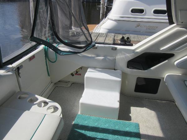 Slide: The Image of 1995 Sea Ray 400 Express Cruiser interior with seating and steps. - 17