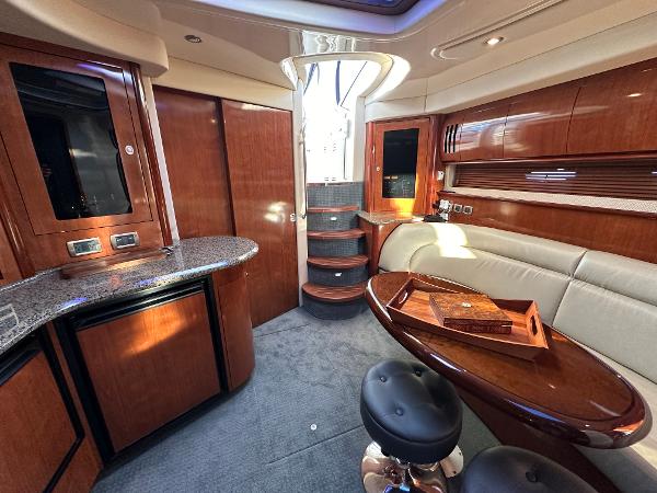 Slide: The Image of Luxurious 2005 Sea Ray 420 Sundancer interior with elegant wood finishes and modern amenities. - 35