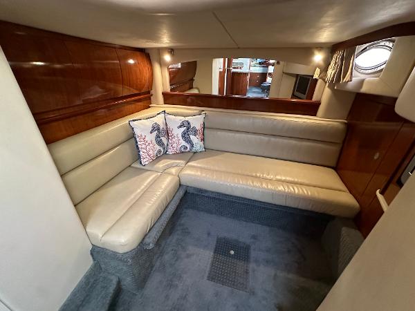 Slide: The Image of Luxurious interior of 2005 Sea Ray 420 Sundancer yacht with leather seating and decorative pillows. - 46