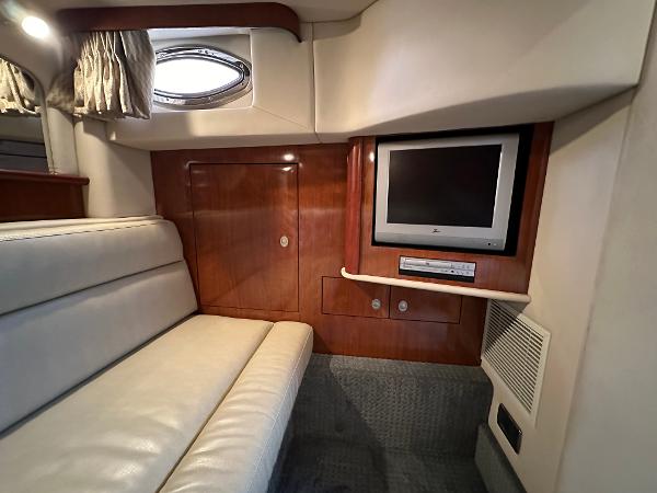 Slide: The Image of Interior of 2005 Sea Ray 420 Sundancer with TV and leather seating. - 48