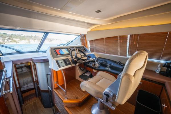 Slide: The Image of Luxurious 2015 Sea Ray 510 Fly yacht interior with modern helm and comfortable seating. - 10