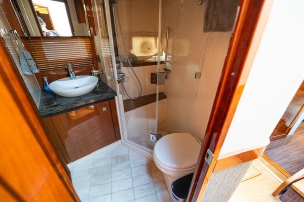 Slide: The Image of Luxurious bathroom in 2015 Sea Ray 510 Fly yacht with modern fixtures. - 11