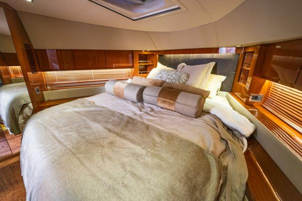 Slide: The Image of Luxurious bedroom interior of 2015 Sea Ray 510 Fly yacht with cozy bedding. - 13