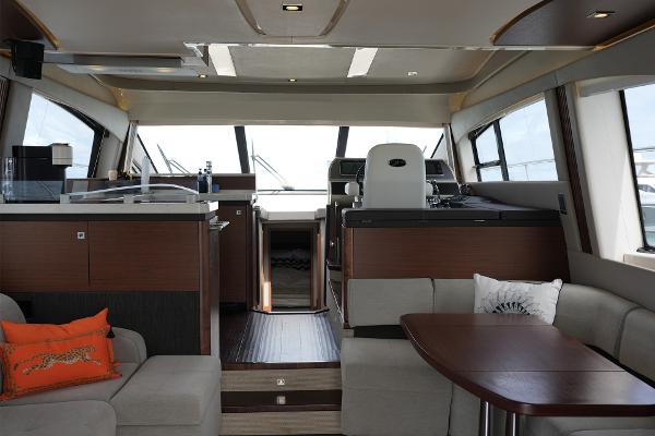 Slide: The Image of Luxurious interior of 2015 Sea Ray 510 Fly yacht with modern furnishings and helm station. - 14