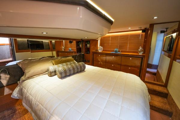 Slide: The Image of Luxurious bedroom interior of 2015 Sea Ray 510 Fly yacht with elegant wood finishes. - 14