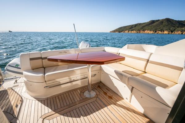 Slide: The Image of 2015 Sea Ray 510 Fly yacht deck with seating and ocean view. - 15