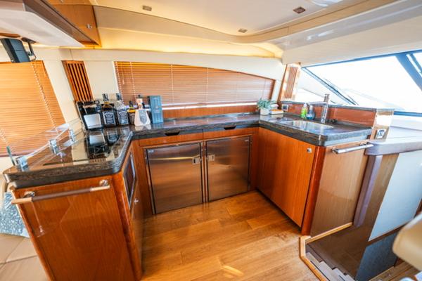 Slide: The Image of Luxurious kitchen interior of 2015 Sea Ray 510 Fly yacht with wooden cabinetry. - 9