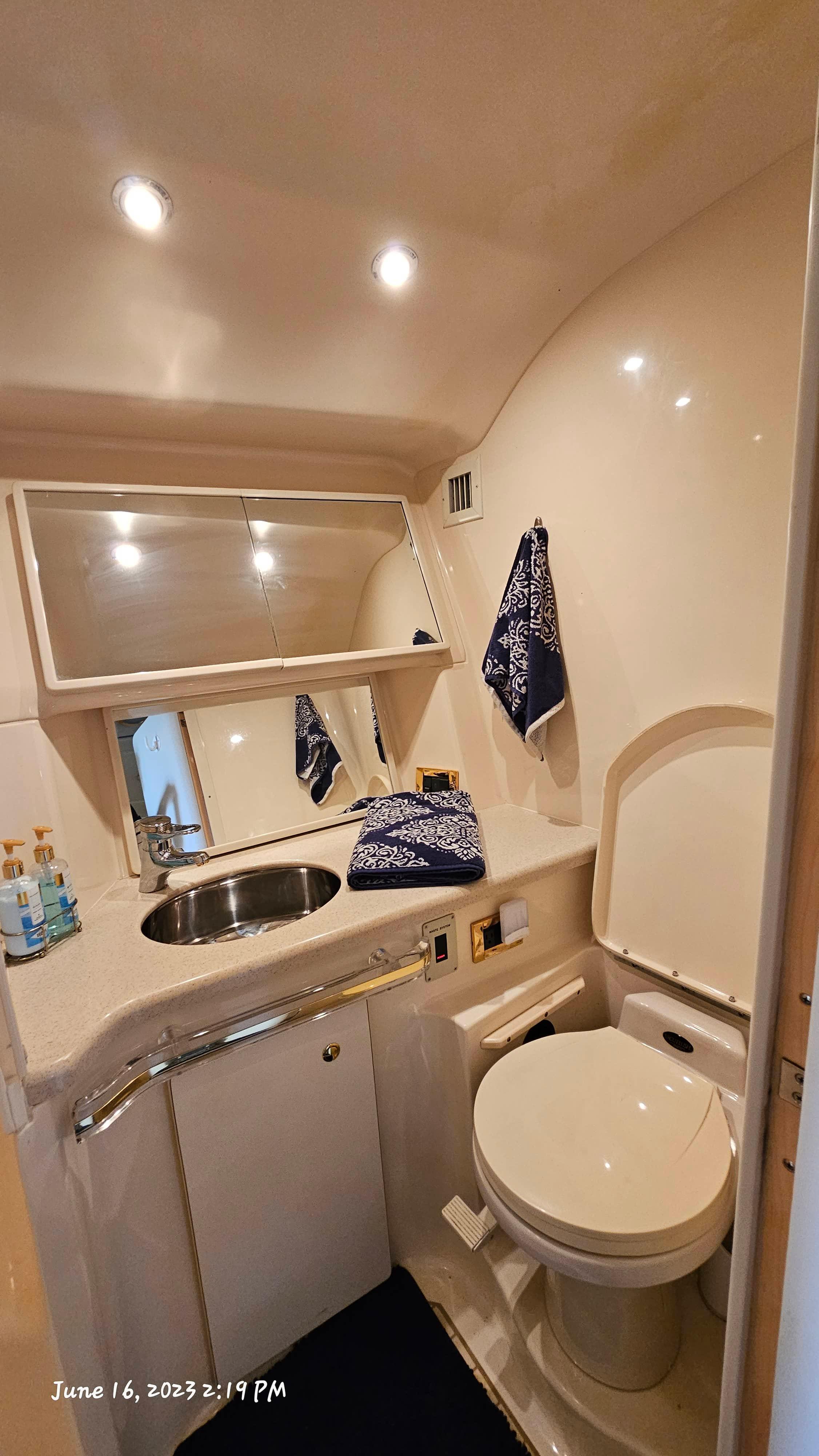 Slide: The Image of Bathroom of 1999 Sea Ray 540 Sundancer yacht with sink, mirror, and toilet. - 20