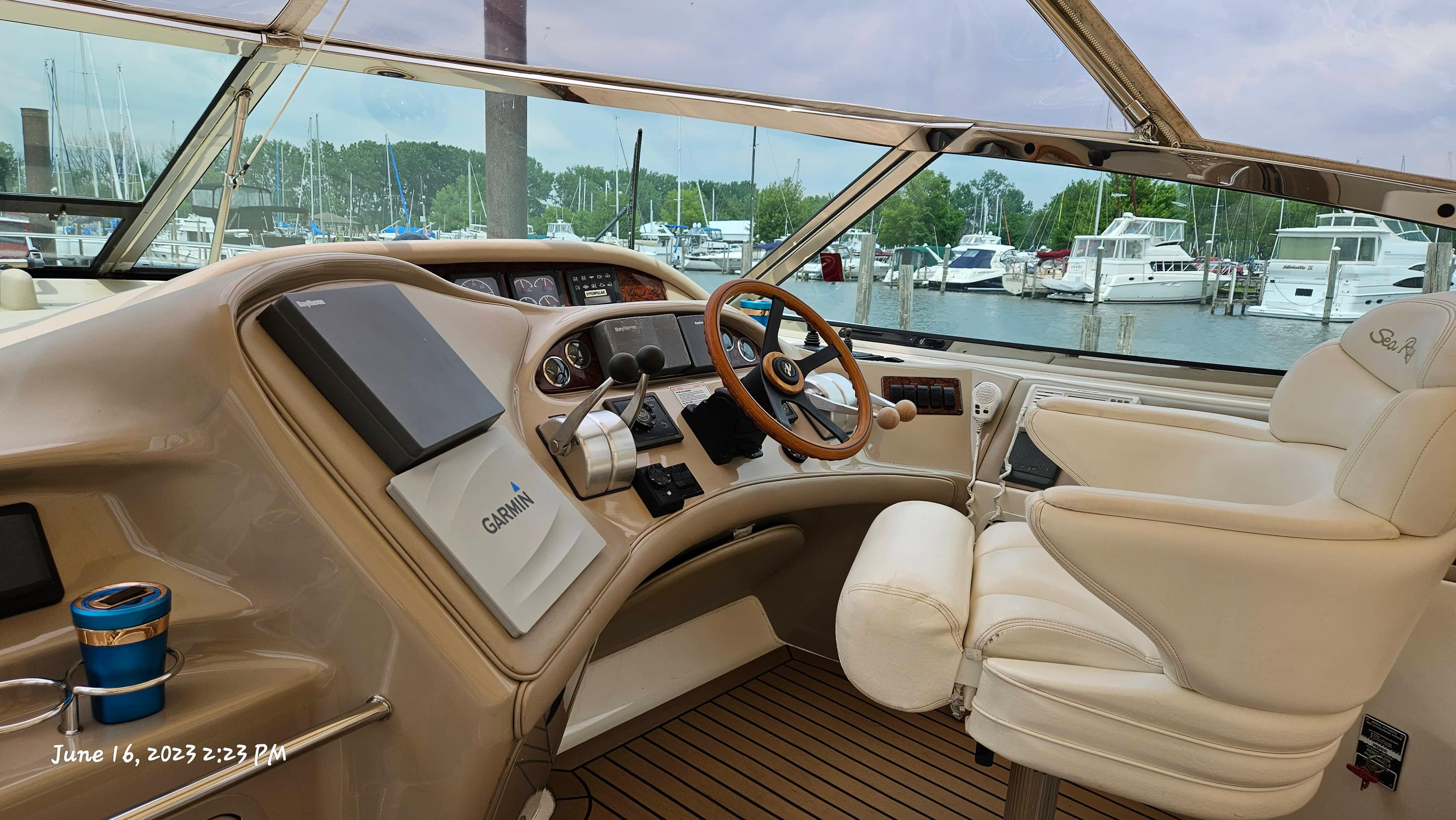 Slide: The Image of Helm of 1999 Sea Ray 540 Sundancer with Garmin navigation, docked at marina. - 28