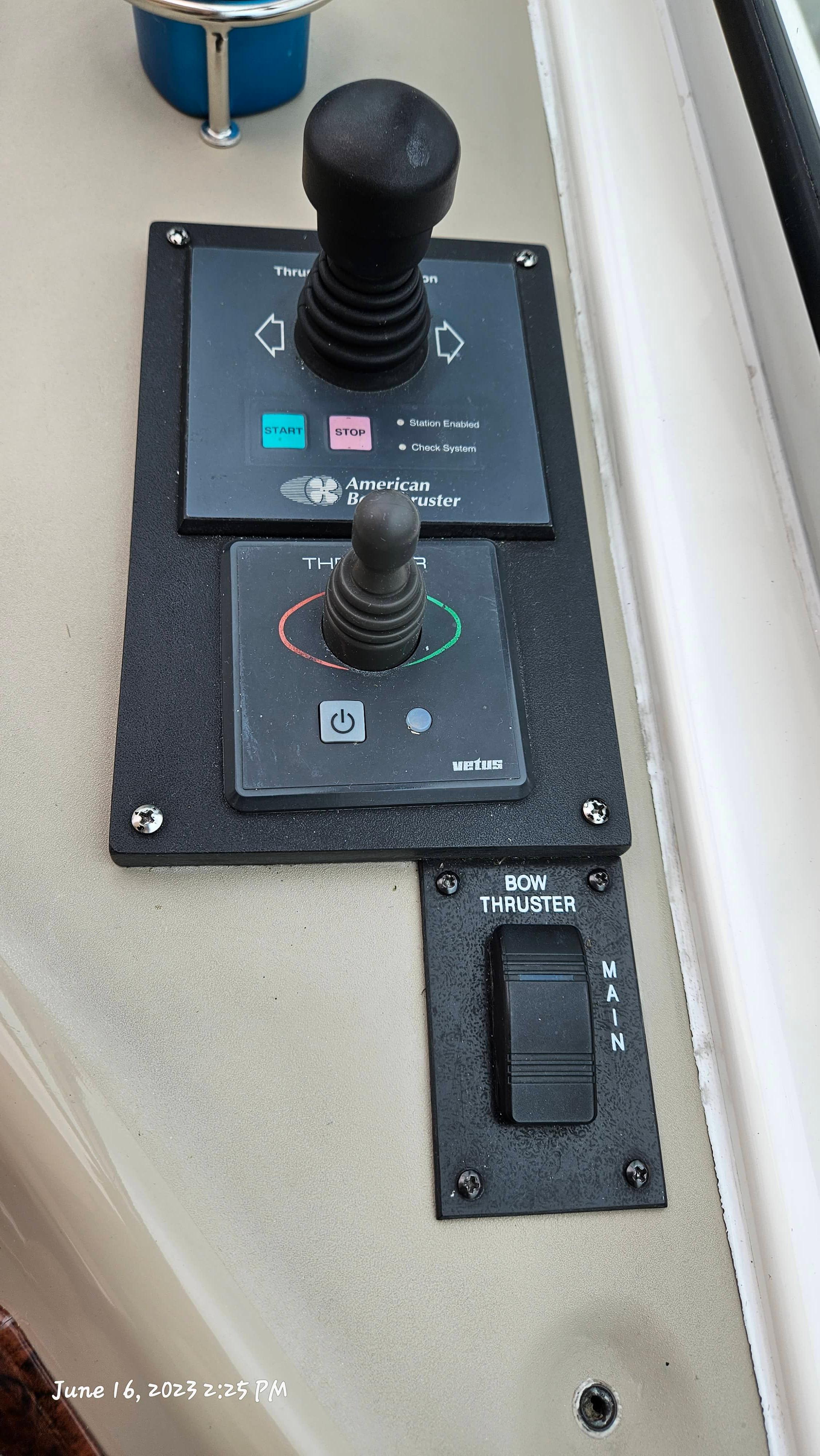 Slide: The Image of Control panel of a 1999 Sea Ray 540 Sundancer boat with thruster controls. - 29