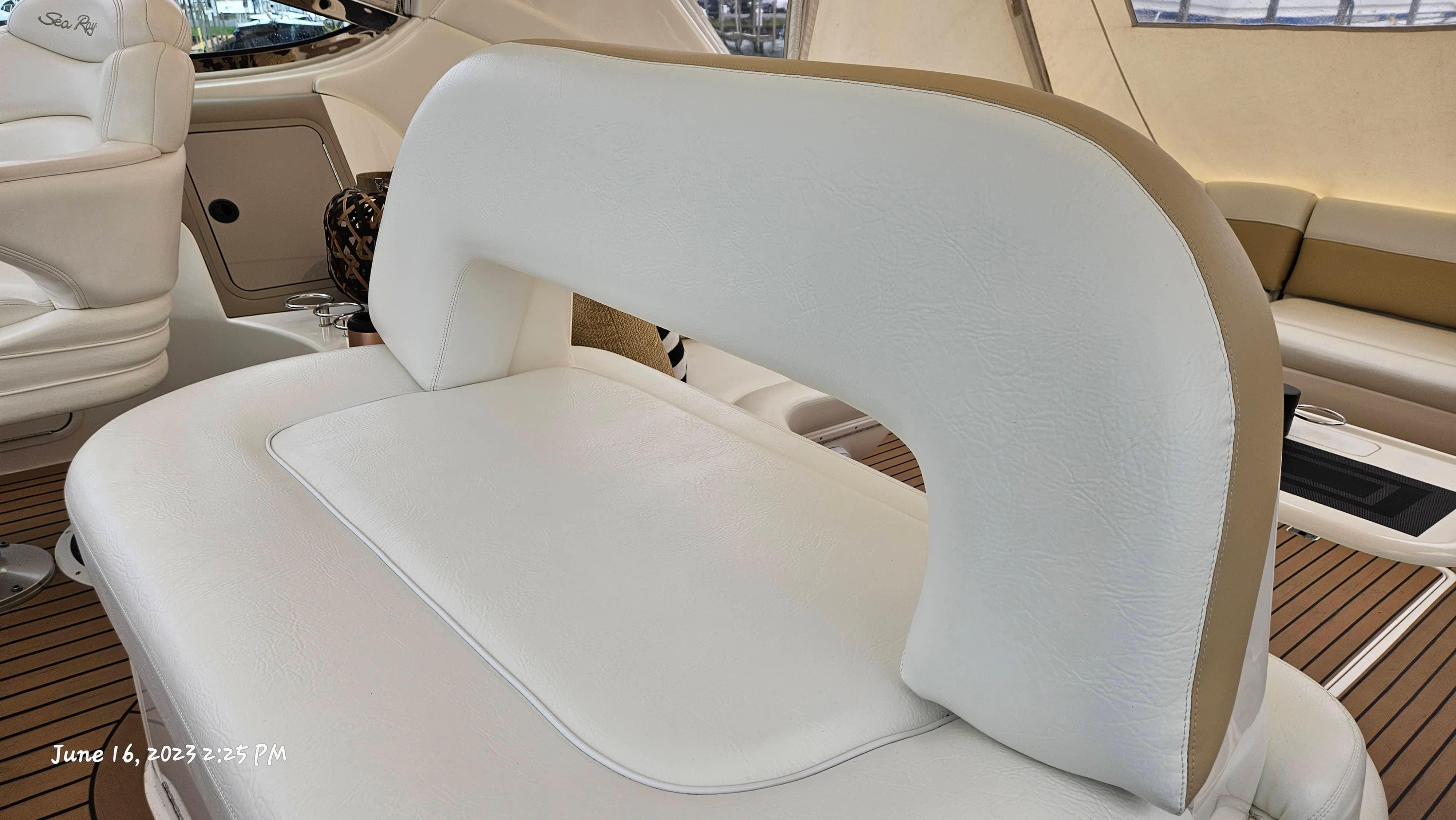 Slide: The Image of Interior seating of a 1999 Sea Ray 540 Sundancer yacht with white leather upholstery. - 31